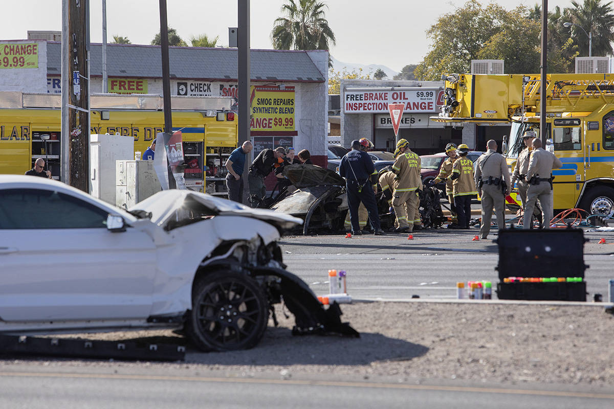 The Las Vegas Fire Department works to evacuate a vehicle involved in a suspected DUI crash on ...