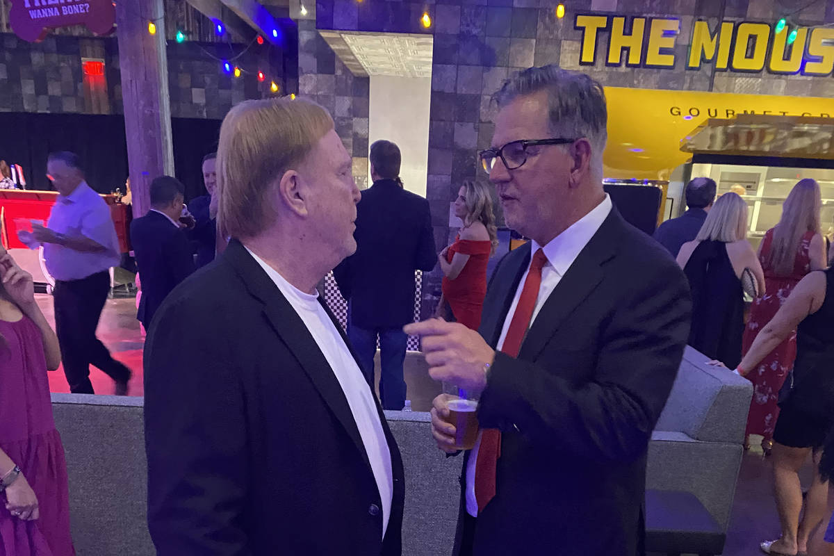 Raiders owner Mark Davis chats with Resorts World President Scott Sibella at the hotel’s ...