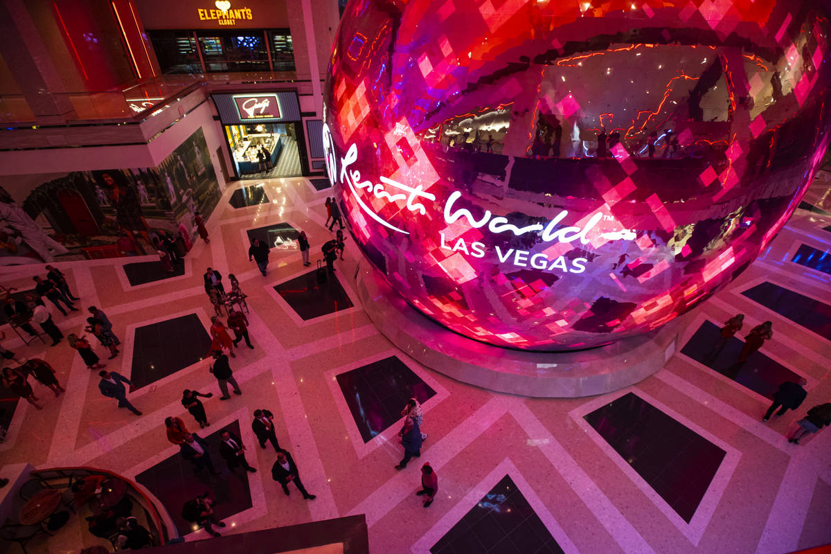 People walk around The District during the opening night of Resorts World Las Vegas on Thursday ...