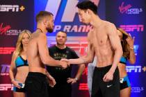 Vasiliy Lomachenko, of the Ukraine, left, and Masayoshi Nakatani, of Japan, shake hands during ...