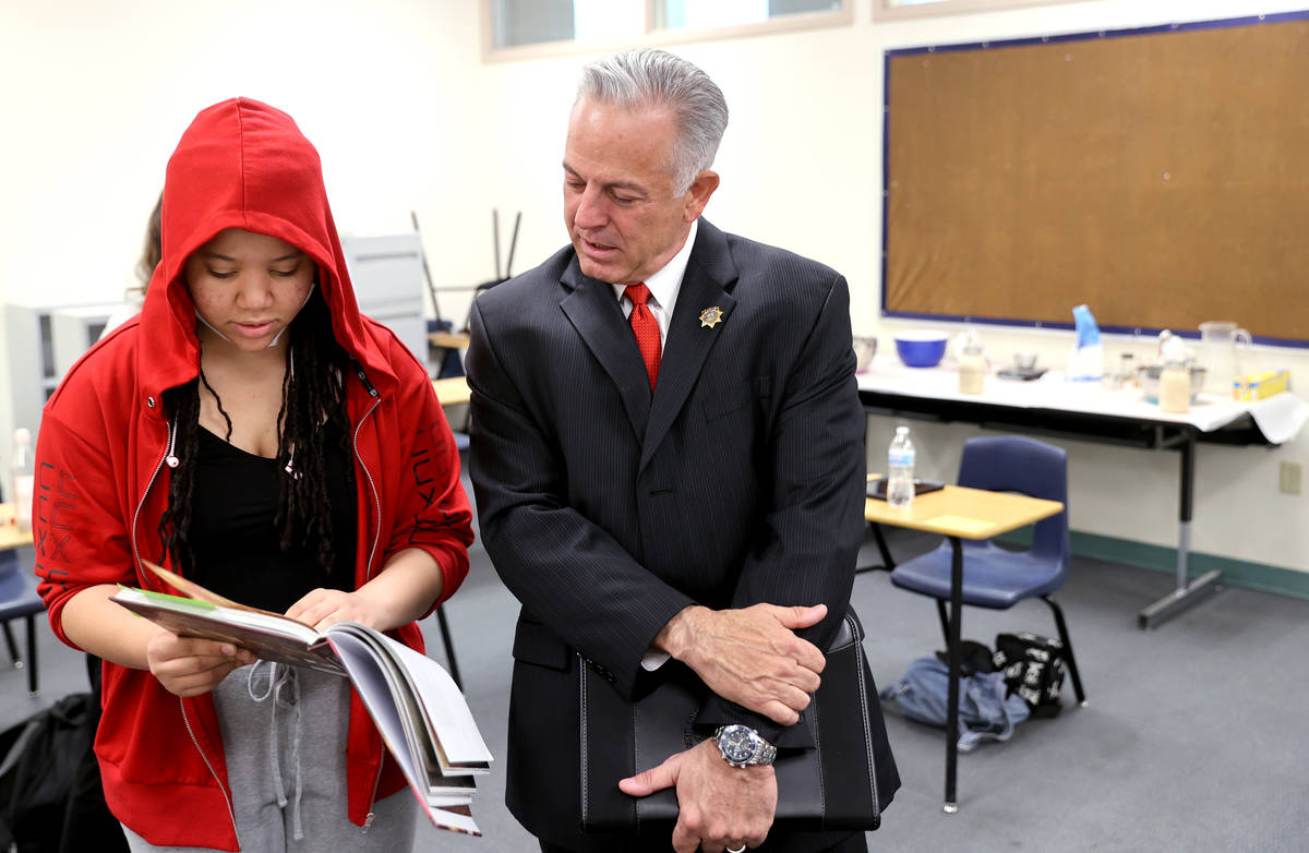 Clark County Sheriff Joe Lombardo meets with student Savanah Mcfarlin, 15, before announcing hi ...