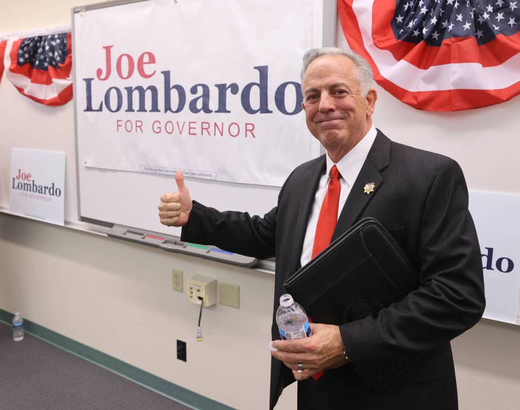 Clark County Sheriff Joe Lombardo poses with his campaign sign after announcing his candidacy f ...