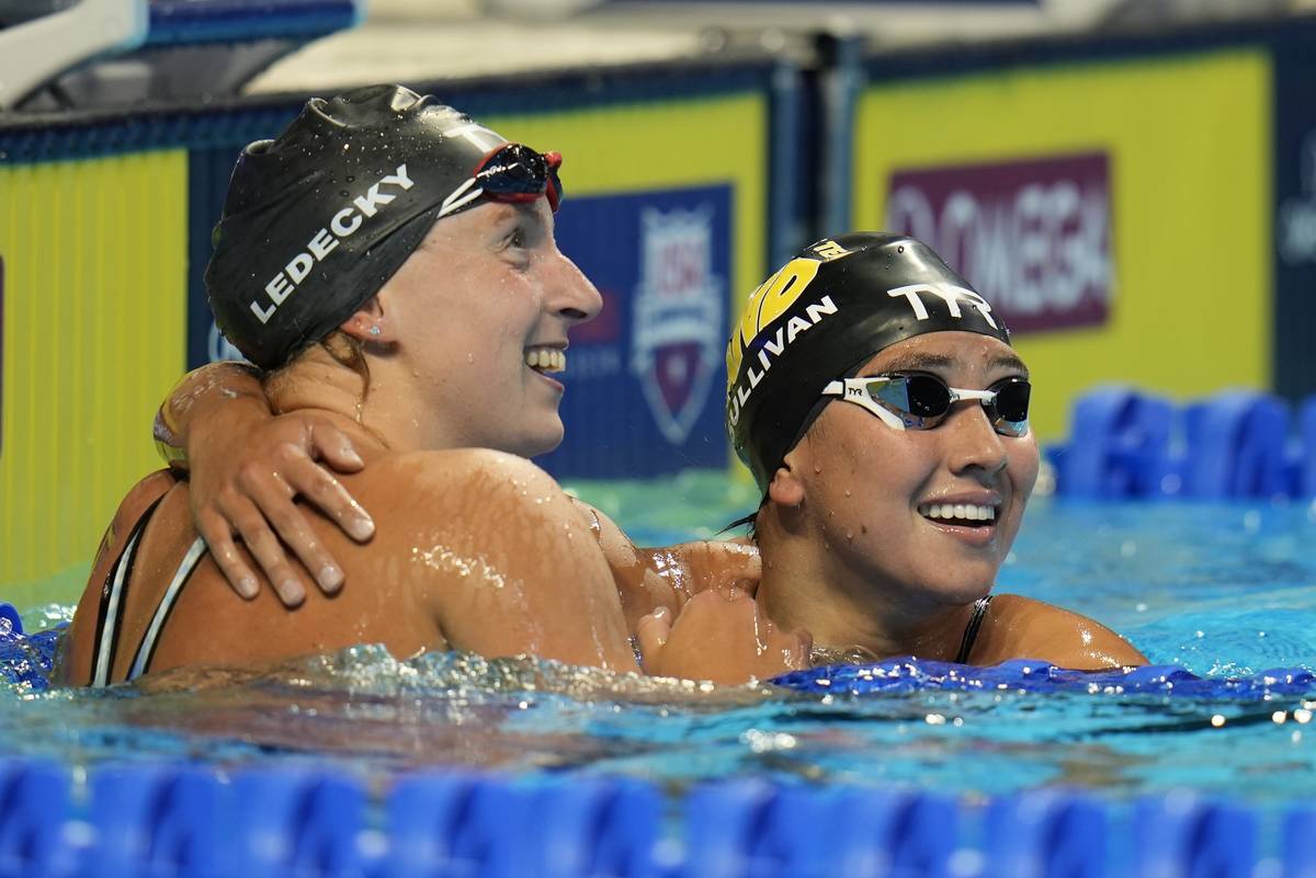 Katie Ledecky hugs Erica Sullivan after winning the women's 1500 freestyle during wave 2 of the ...