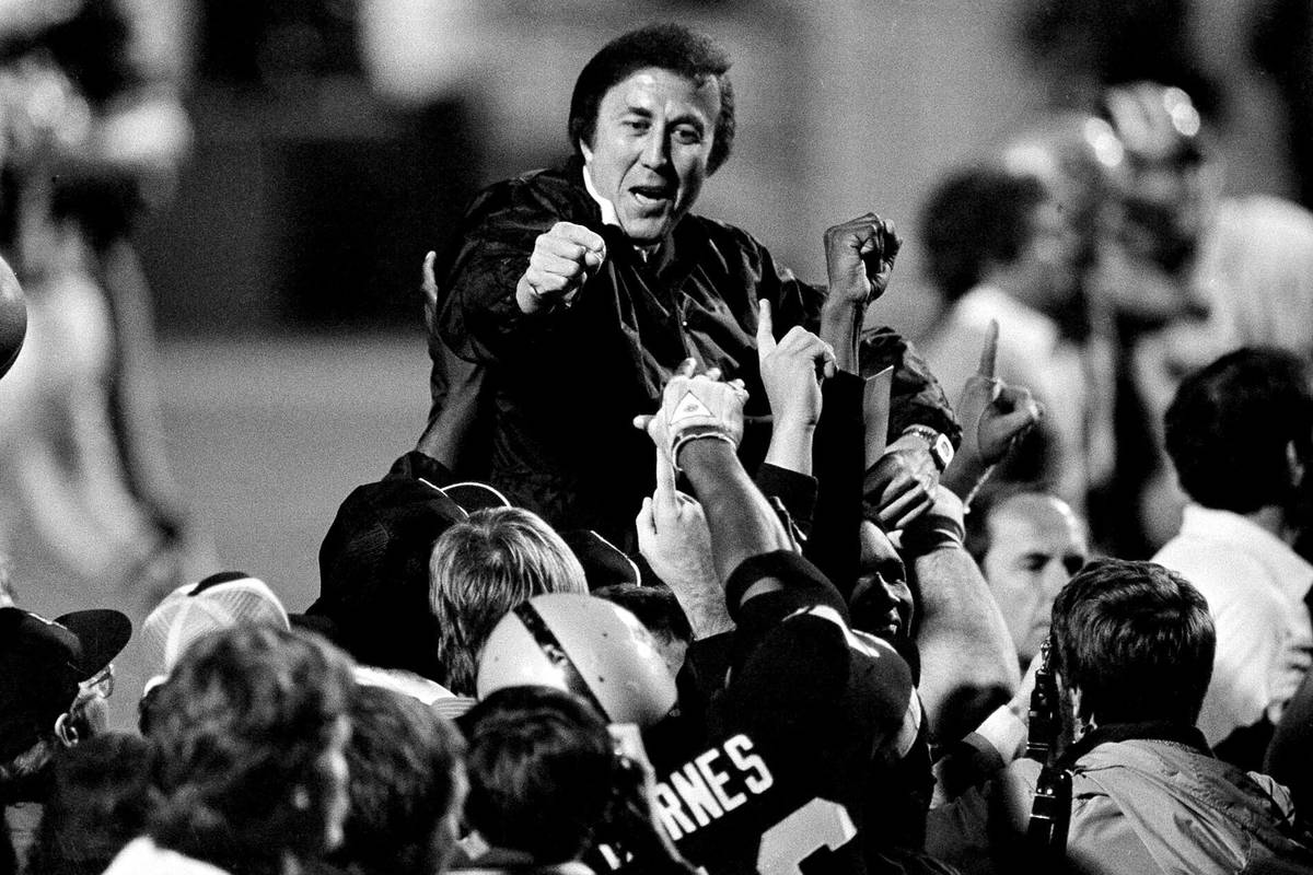 In this Jan. 23, 1984, file photo, coach Tom Flores gestures to members of the Los Angeles Raid ...