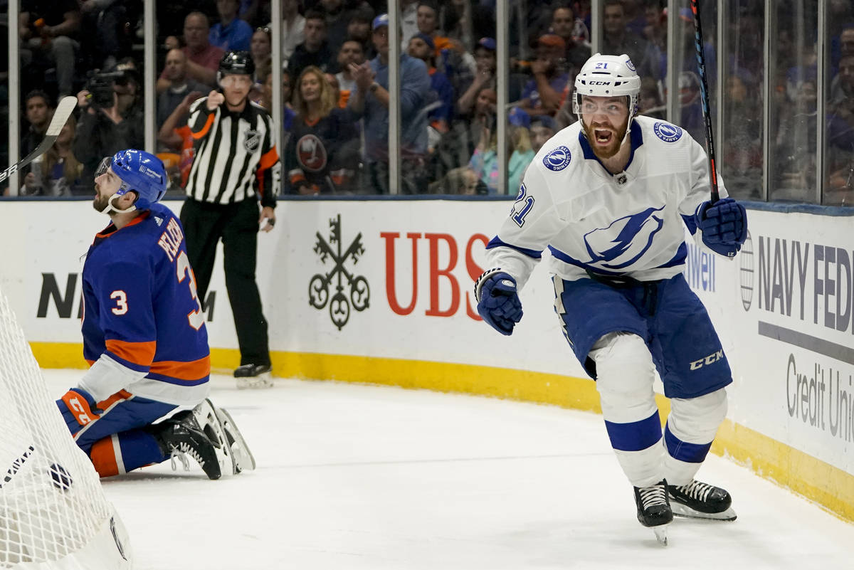 Tampa Bay Lightning center Brayden Point (21) reacts after scoring against the New York Islande ...