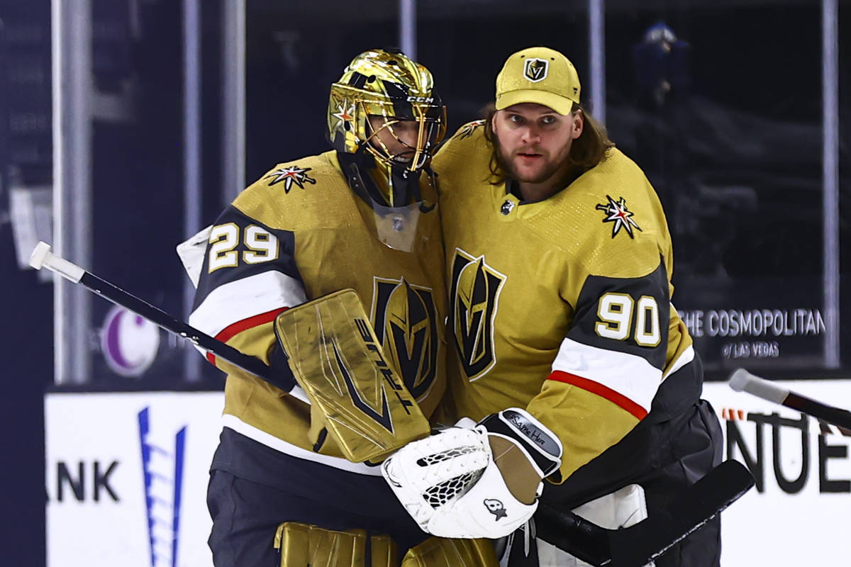 Golden Knights goaltenders Marc-Andre Fleury (29) and Robin Lehner (90) celebrate after their o ...