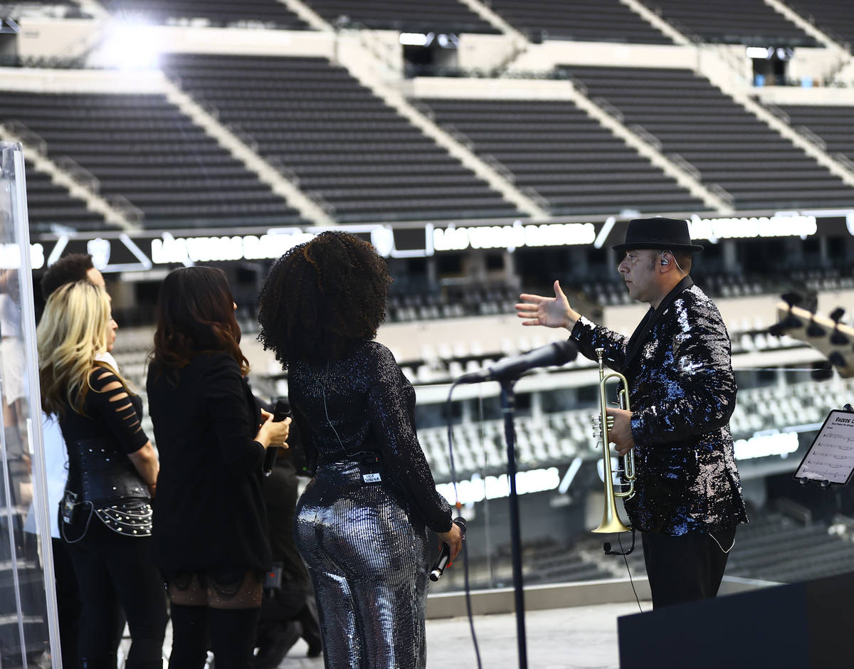 David Perrico, right, leads David PerricoÕs Pop Strings band at Allegiant Stadium in Las V ...