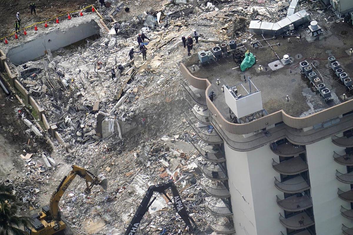 Rescue workers search in the rubble at the Champlain Towers South Condo, Saturday, June 26, 202 ...