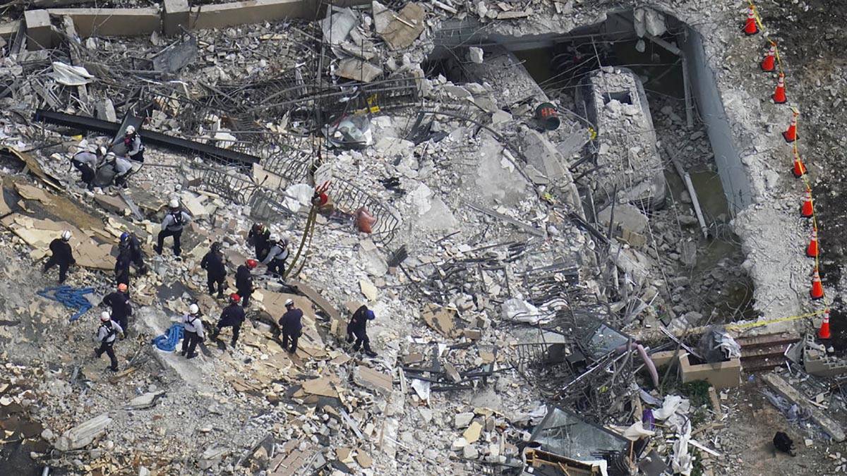 Rescue workers search in the rubble at the Champlain Towers South Condo, Saturday, June 26, 202 ...