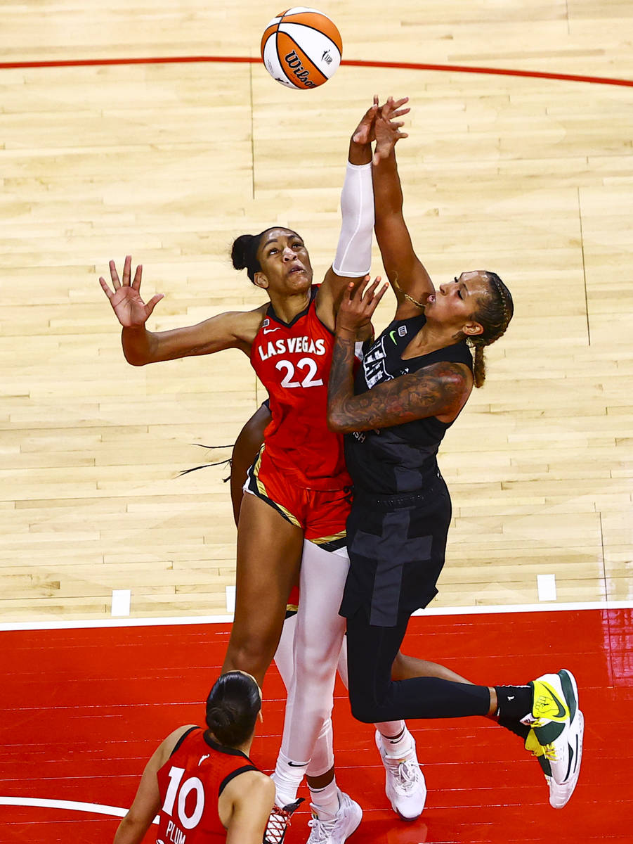 Seattle Stormճ Mercedes Russell, right, shoots while getting fouled by Las Vegas Aces&#x5 ...