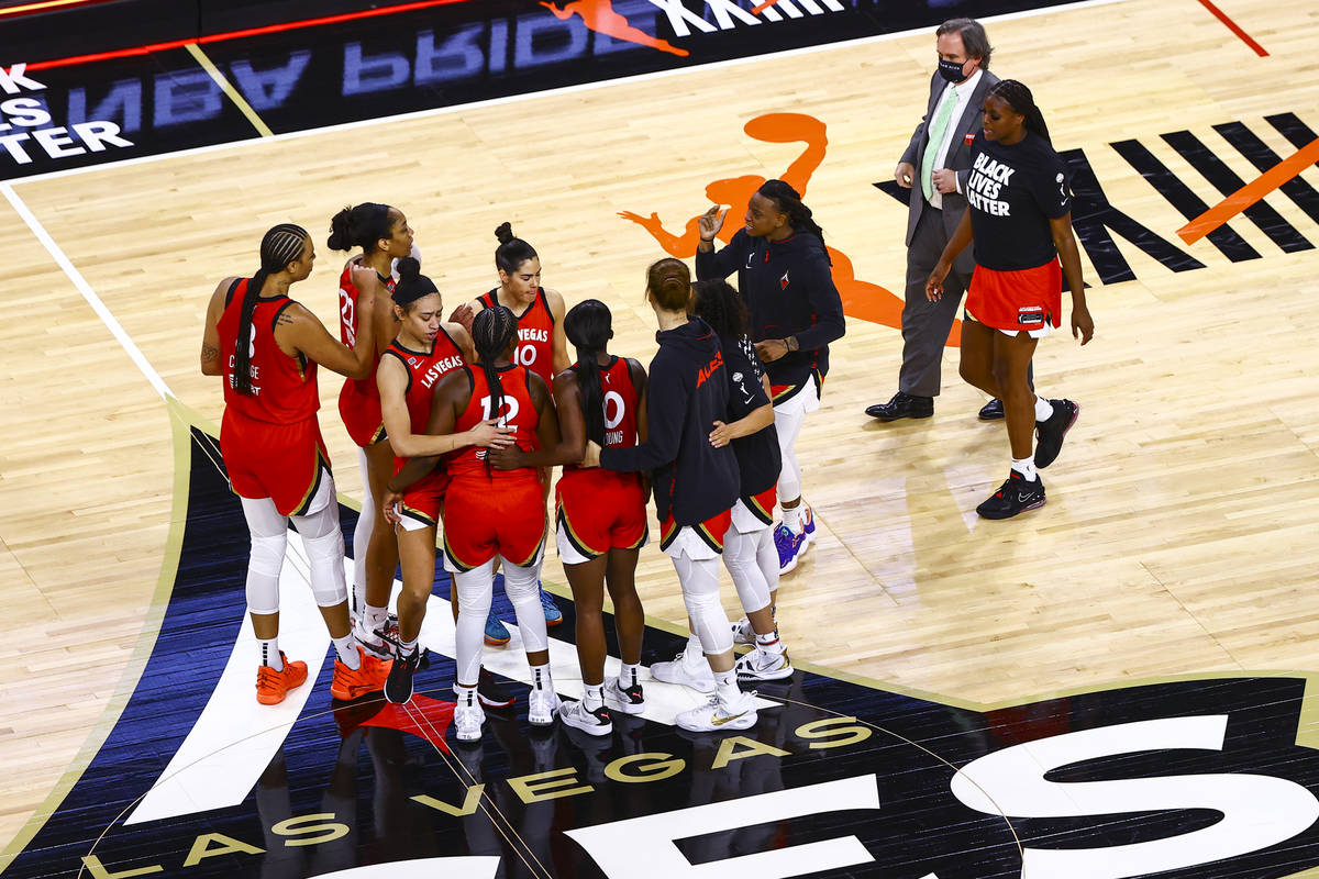 The Las Vegas Aces celebrate following an overtime win against Seattle Storm in a WNBA basketba ...
