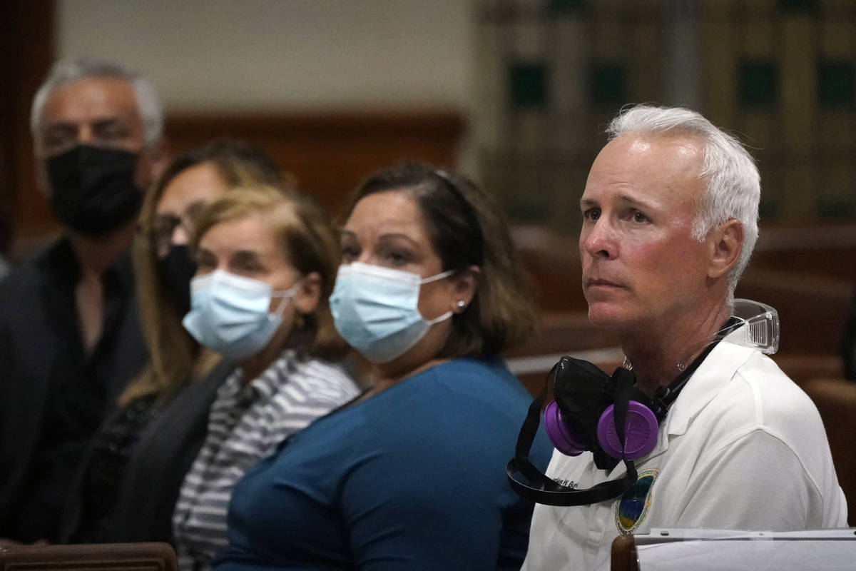Surfside, Fla., Mayor Charles Burkett, right, joins worshipers, late Saturday, June 26, 2021, d ...