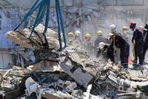 Crews work in the rubble at the Champlain Towers South Condo, Sunday, June 27, 2021, in Surfsid ...