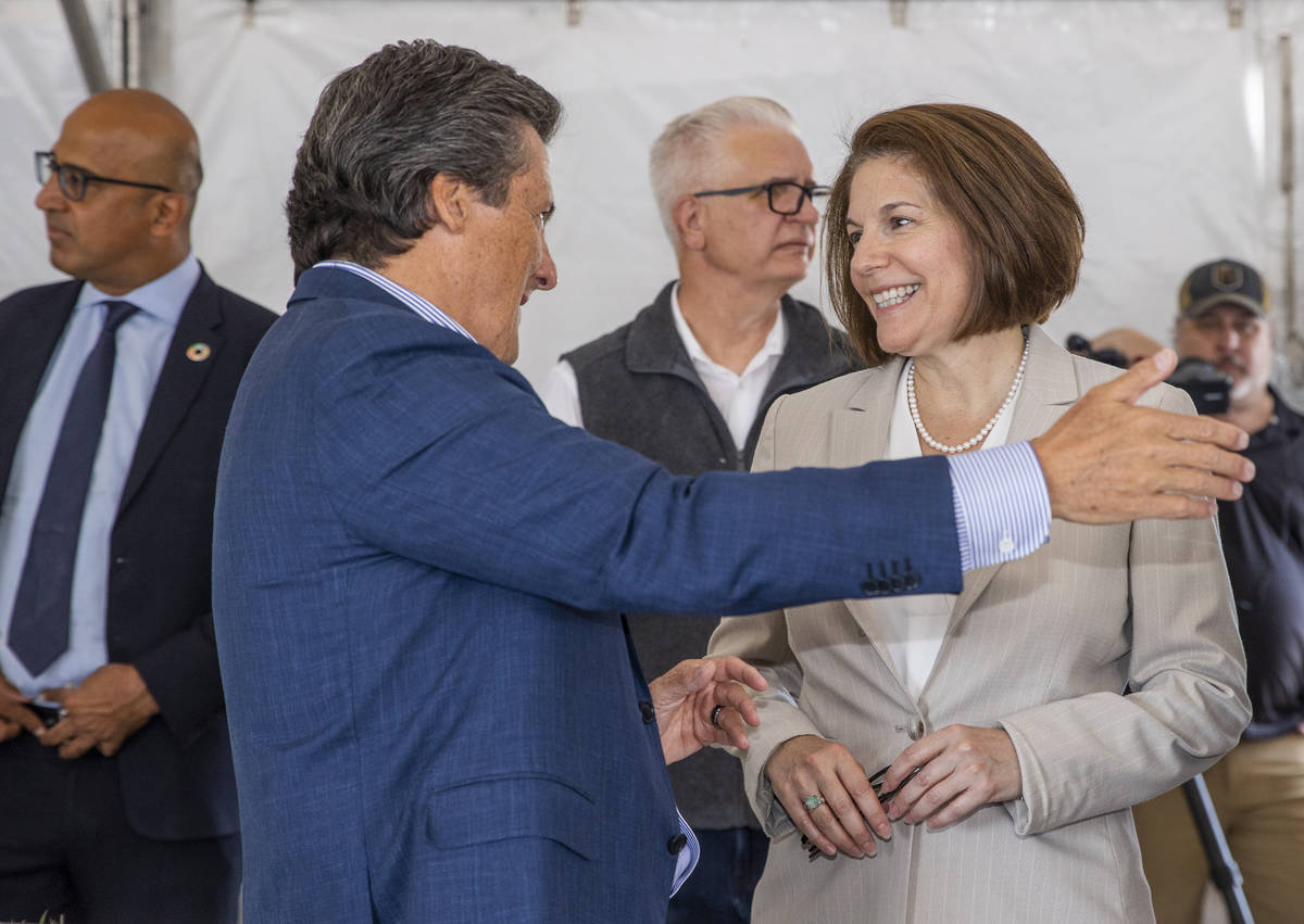 Bill Hornbuckle, CEO and president of MGM Resorts, chats with Sen. Catherine Cortez Masto durin ...