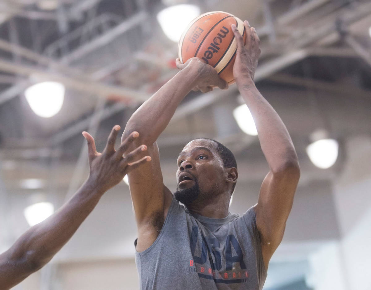 Golden State Warriors guard Kevin Durant (52) shoots three point shots during Team USA basketb ...
