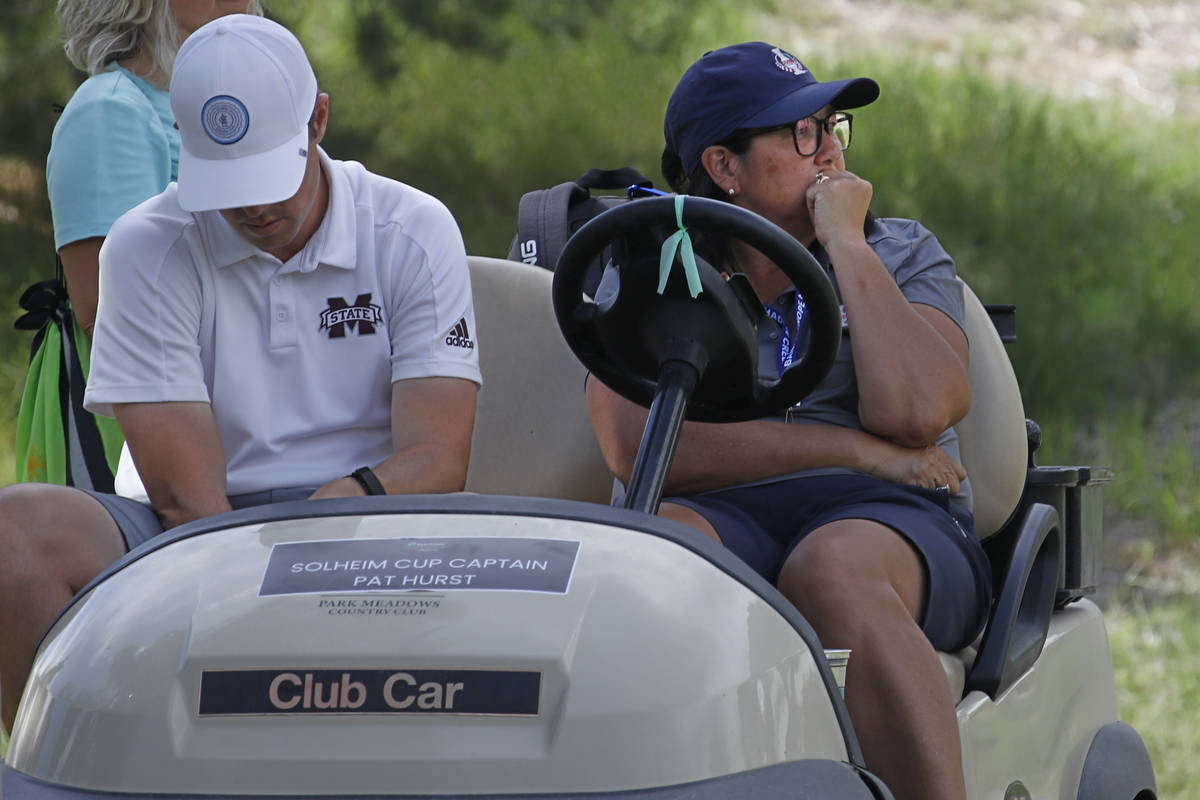 Team USA Solheim Cup Captain Pat Hurst, right, drives a golf cart during the quarter final ...