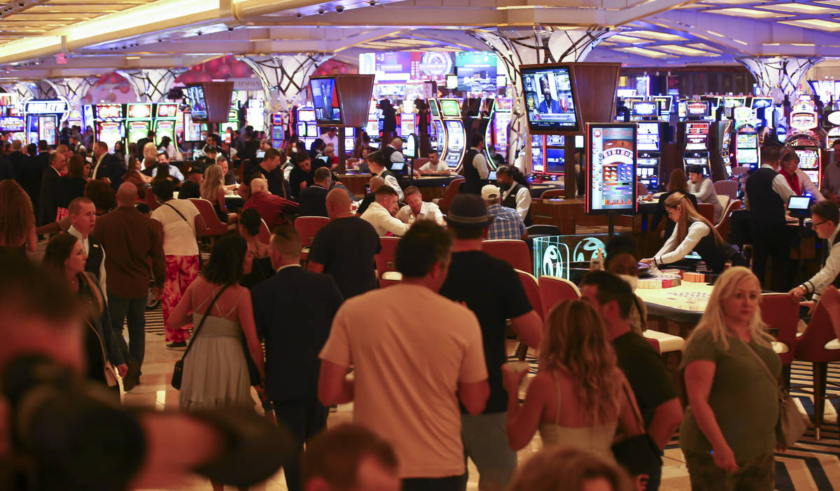 People gamble on the casino floor as Resorts World Las Vegas opens to the public on Thursday, J ...