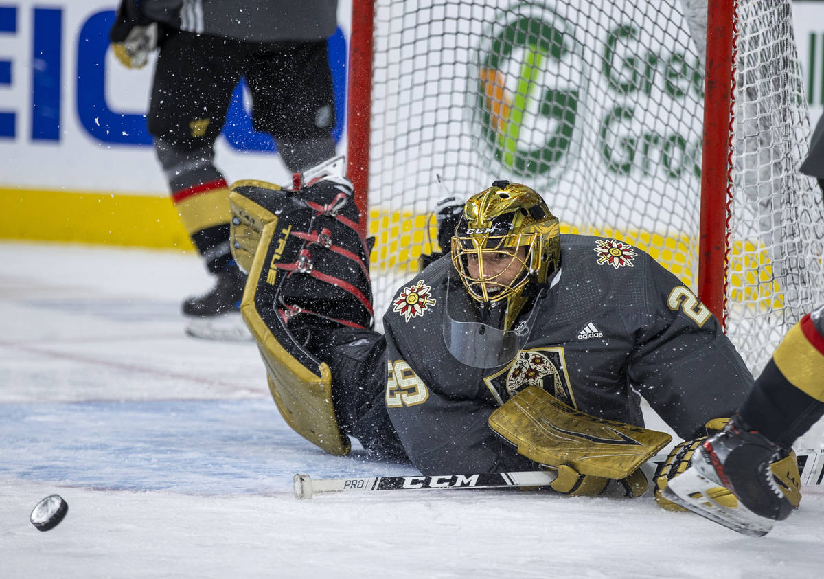 Golden Knights goaltender Marc-Andre Fleury (29) laughs while rejecting teammates shots during ...