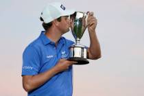 Harris English kisses the winners trophy after winning the Travelers Championship golf tourname ...