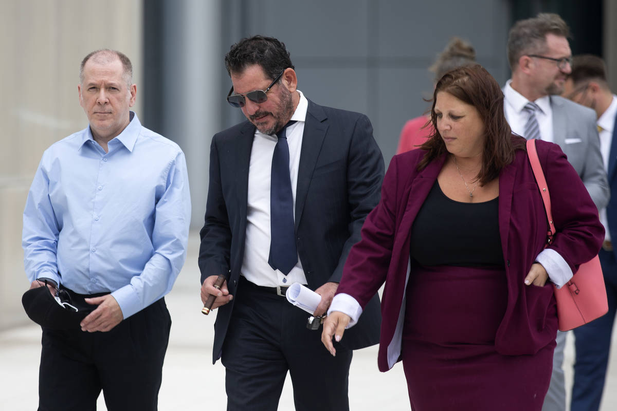 Former 24/7 Private Vaults employee Larry Anthony McDaniel, left, and his attorney Todd Leventh ...