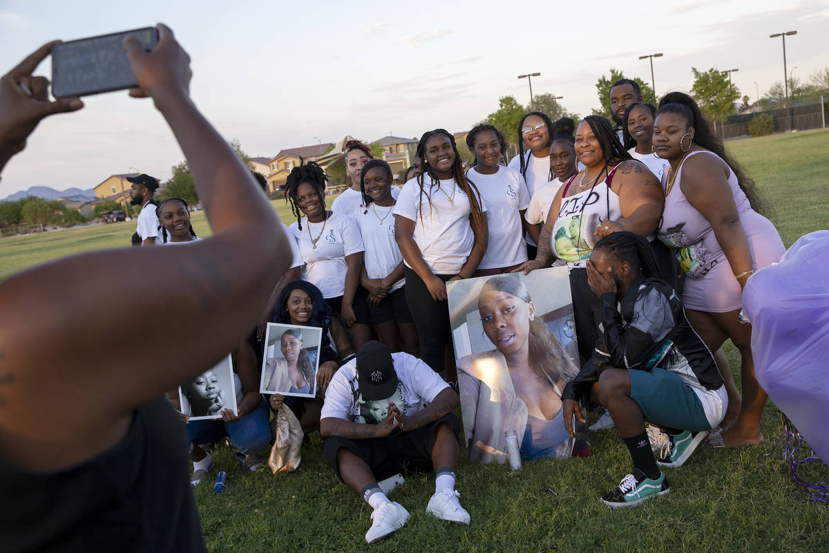 Loved ones of 18-year-old Shania James, who was shot and killed in Las Vegas last week, pose fo ...