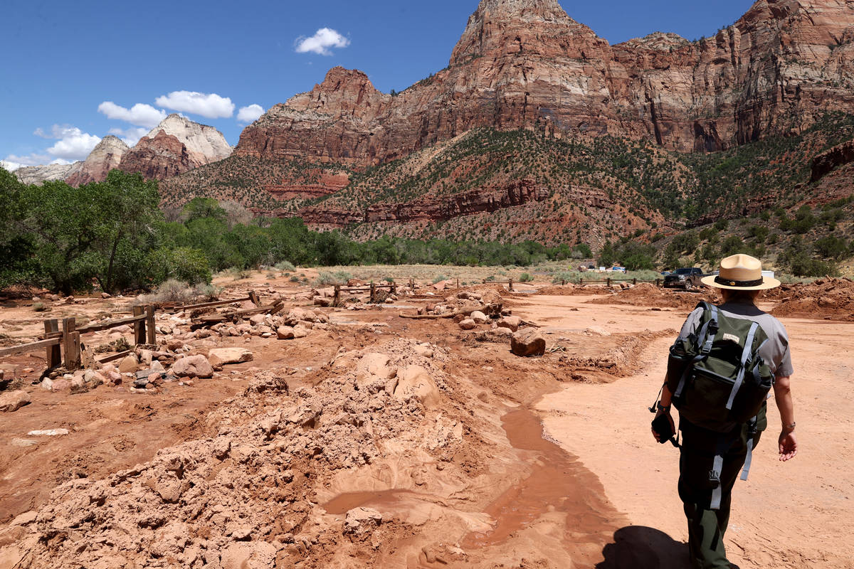 Zion National Park spokeswoman Amanda Rowland shows mud and debris in the oversized vehicle par ...