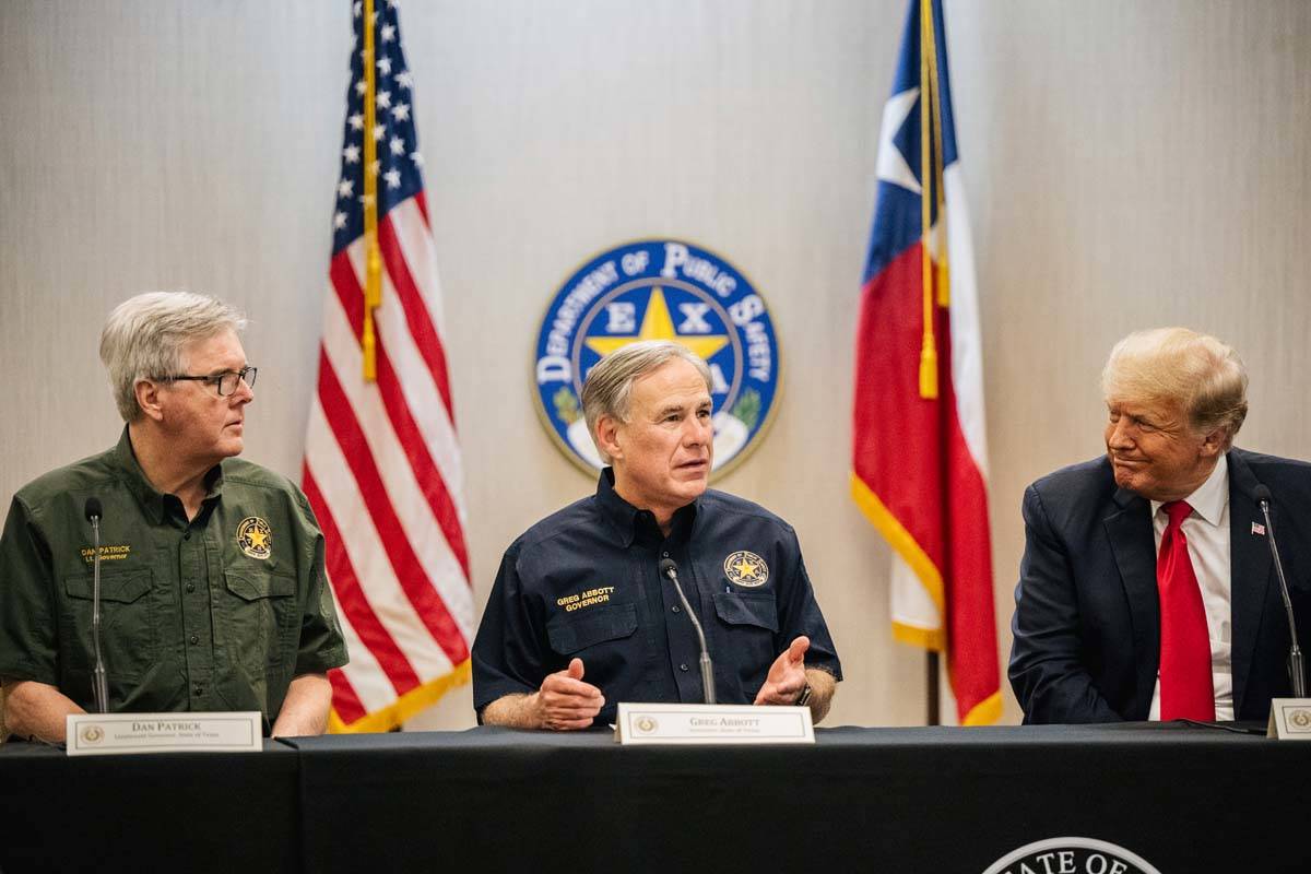 Texas Lt. Gov. Dan Patrick, left, Texas Gov. Greg Abbott, center, and former President Donald T ...