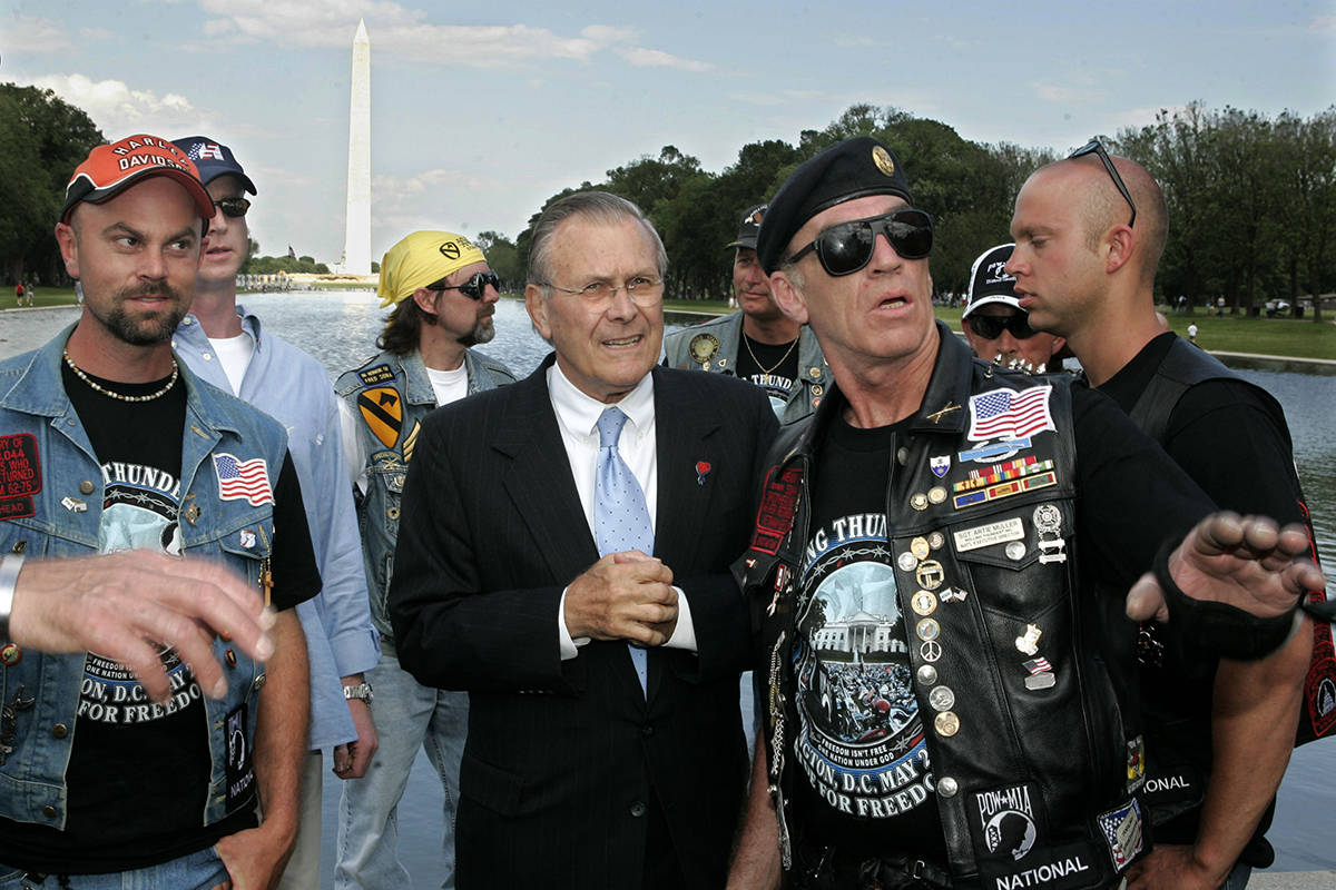 Secretary of Defense Donald Rumsfeld stands with Artie Muller, third from right, president of R ...