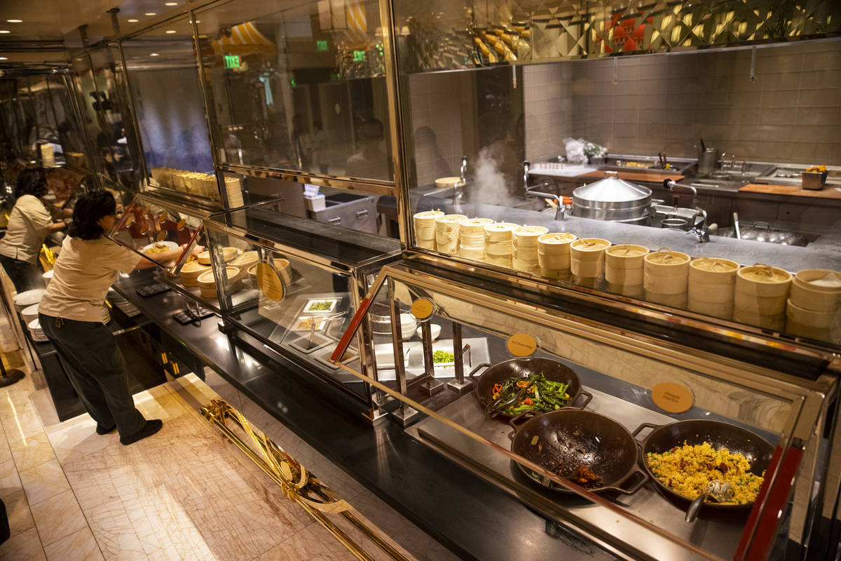 People serve their own food at The Buffet at Wynn Las Vegas, Wednesday, June 30, 2021 in Las Ve ...