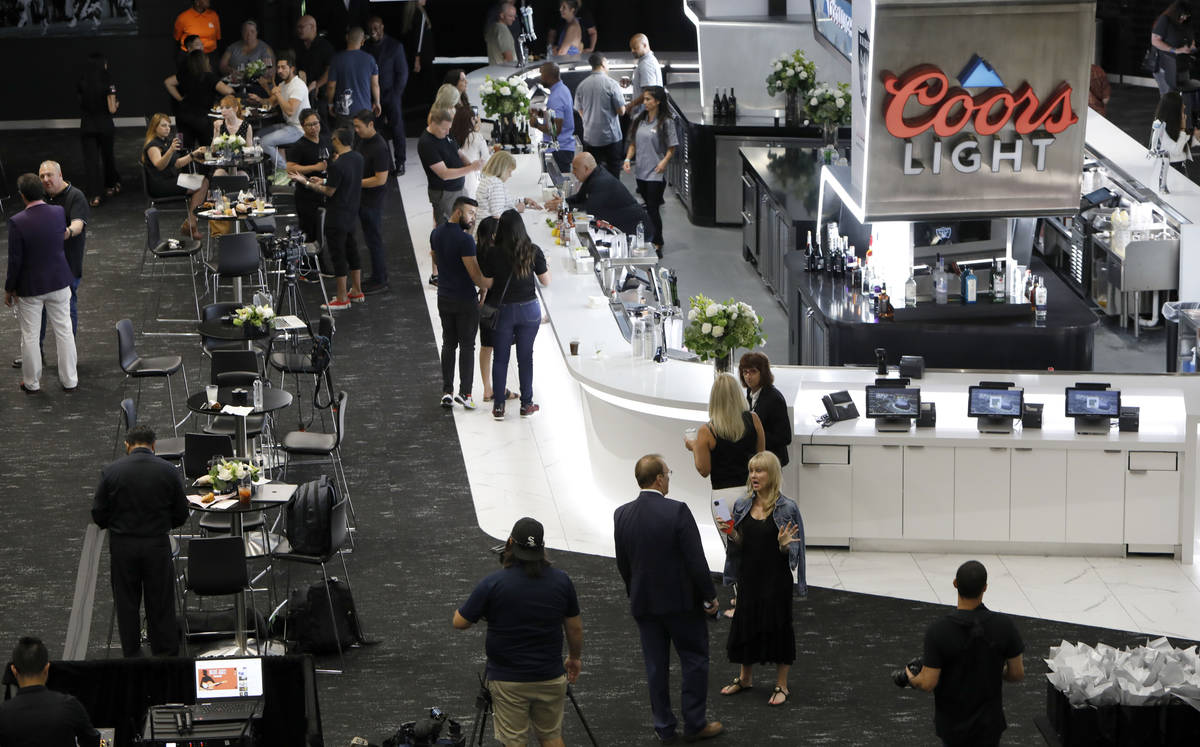 Guests enjoy foods and drinks during an event of food and beverage experience at Allegiant Stad ...