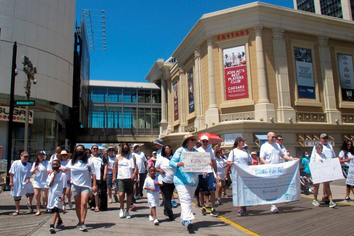 Casino workers and smoking opponents march on the Atlantic City N.J., Boardwalk on Wednesday, J ...