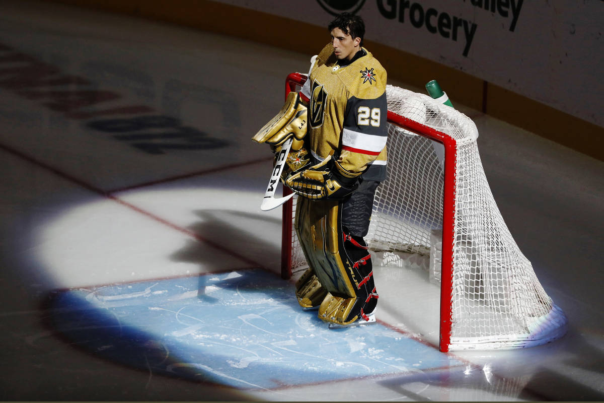 Golden Knights goaltender Marc-Andre Fleury (29) pauses during the National Anthem before the f ...