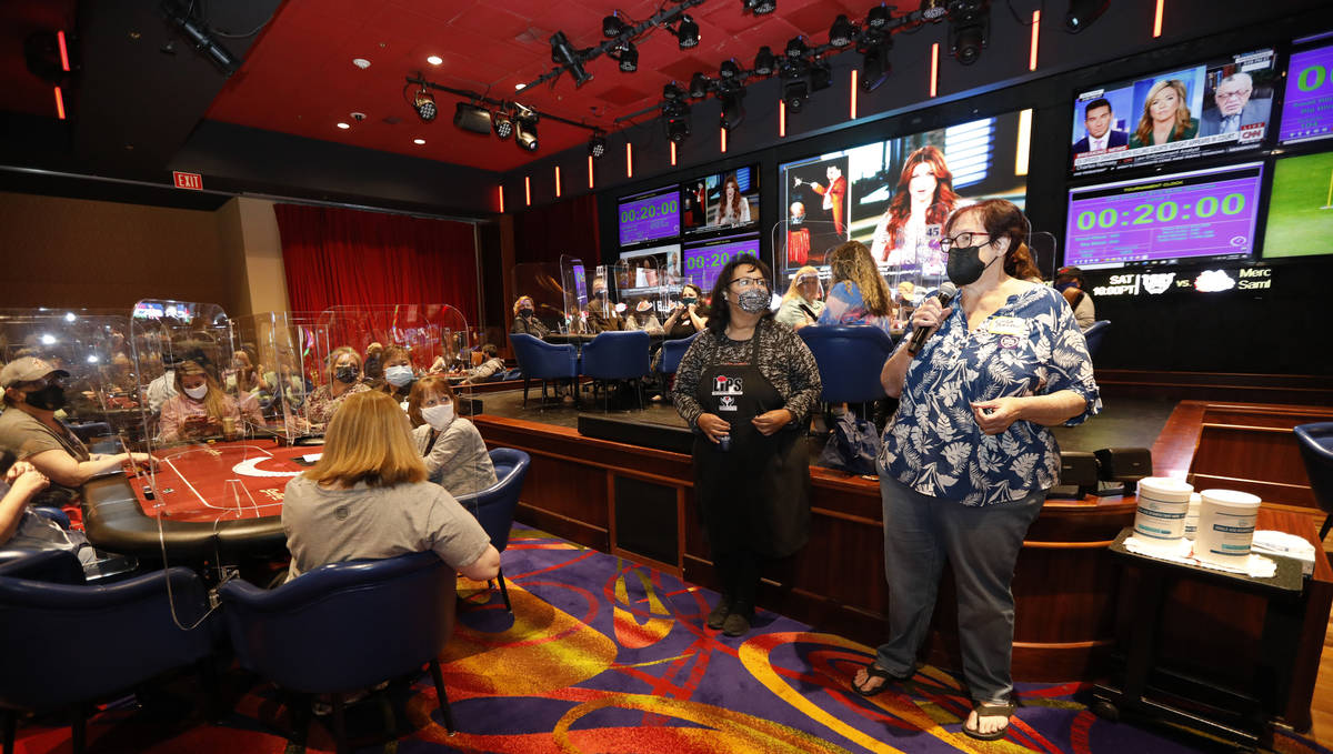 Linda Johnson, co-host of 2021 Nevada State Ladies Poker Championship, right, speaks before $17 ...