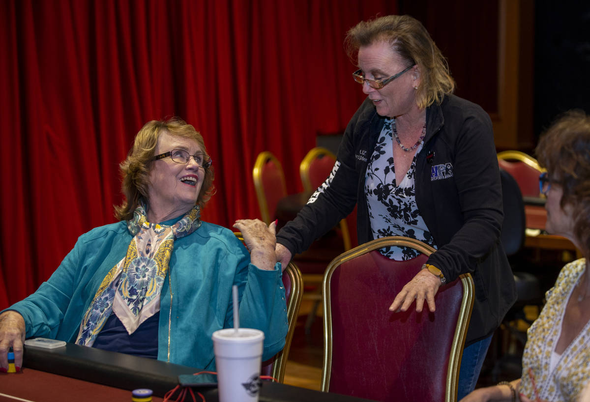 Players Patty Pfeil, left, and Liz Huey talk in between hands as they compete in the $350 buy-i ...