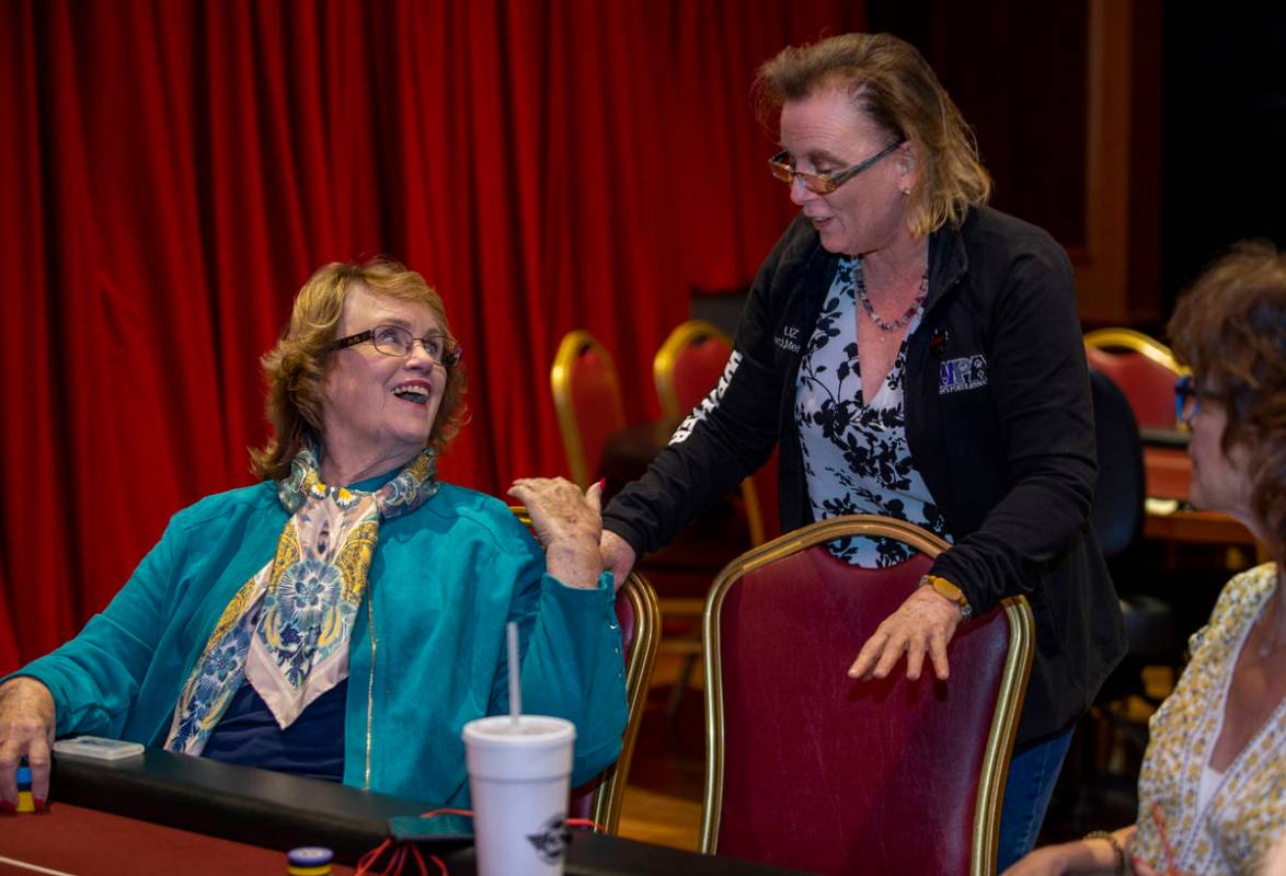 Players Patty Pfeil, left, and Liz Huey talk in between hands as they compete in the $350 buy-i ...