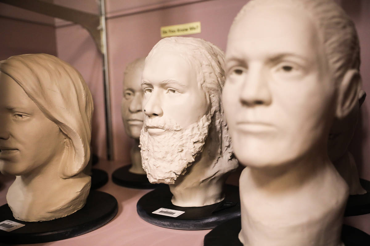 Busts depicting unidentified bodies or bodies that were previously unidentified sit in a glass ...