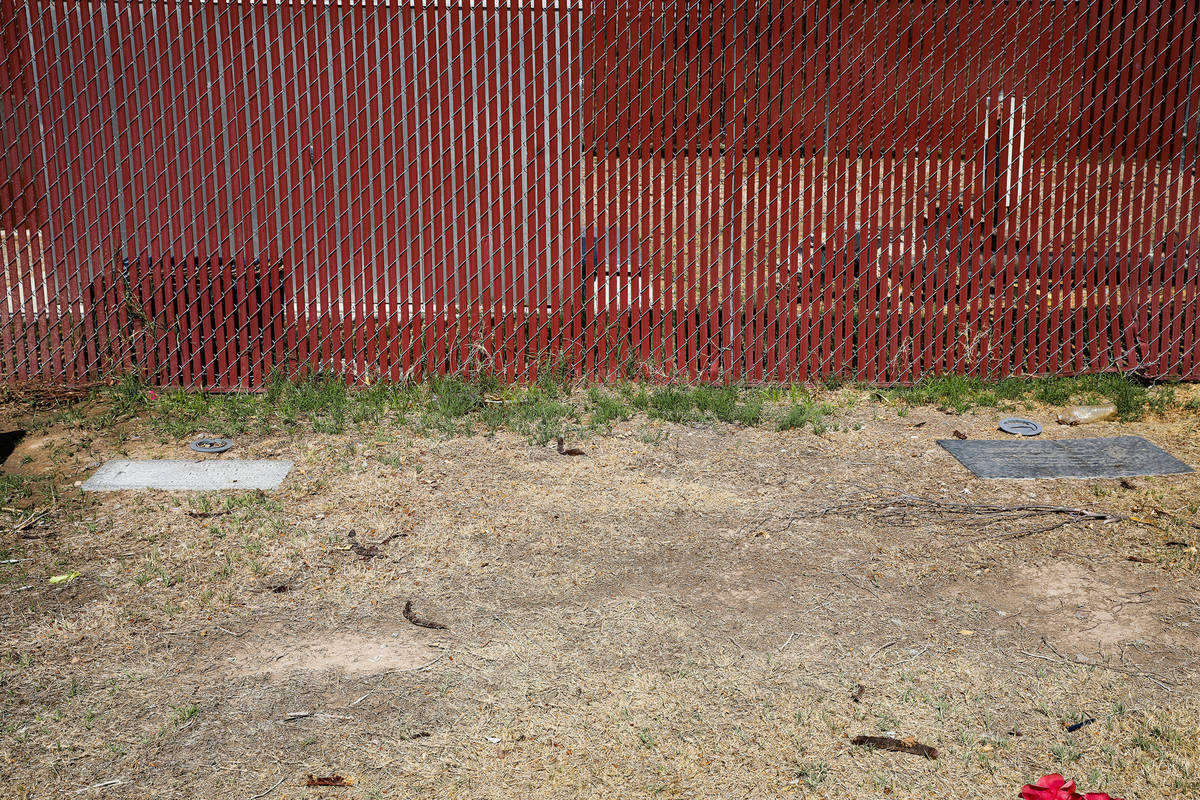 In the area unmarked between the headstones lie unidentified bodies at Woodlawn Cemetery in Las ...