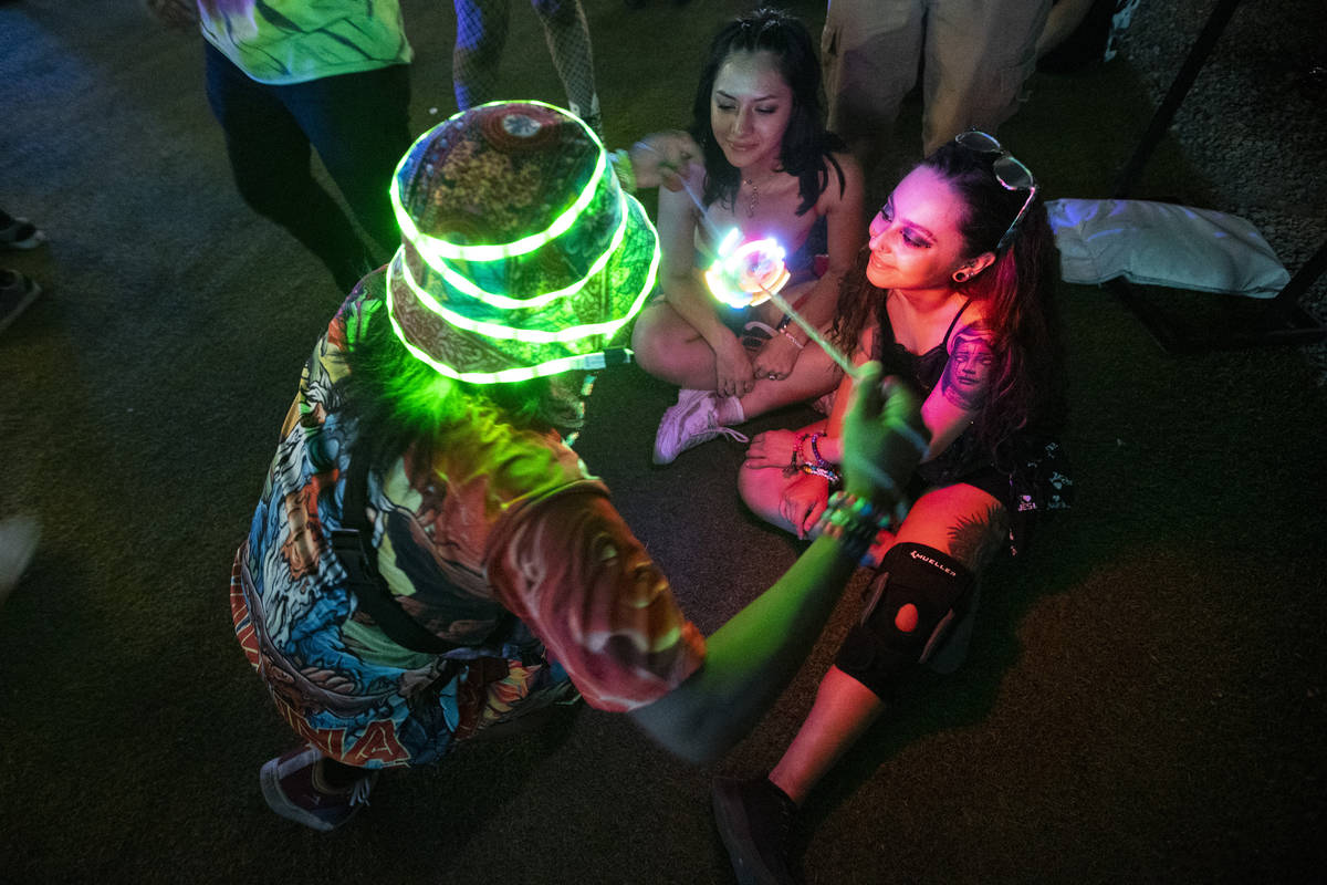 Friends from left, Gustavo Bautista, Alyssa Llorada, and Jollieanna Bocanegra, attend a concert ...