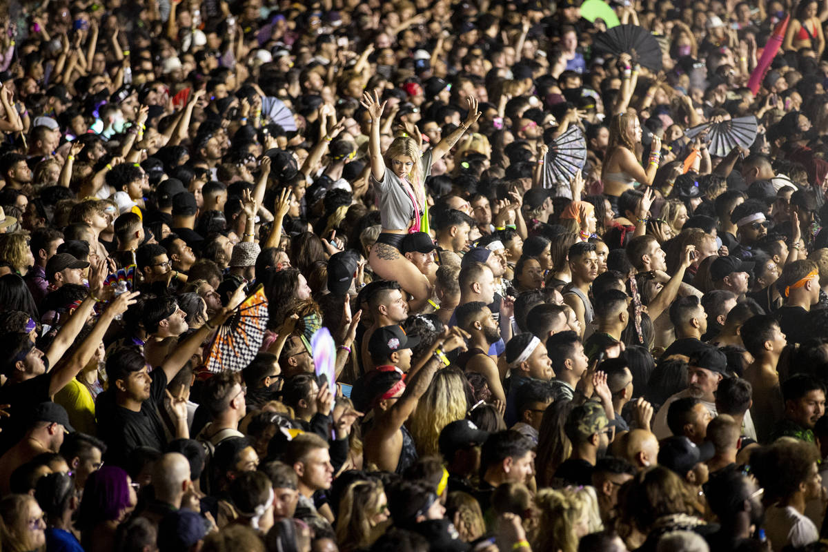 People dance to Excision performing at the Downtown Las Vegas Events Center in Las Vegas, Satur ...