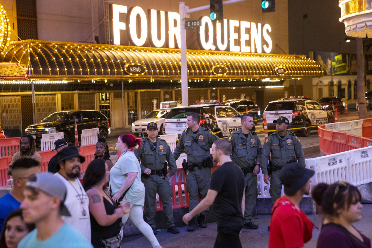 Las Vegas police officers keep watch at the Fremont Street Experience in Las Vegas, Friday, Jul ...