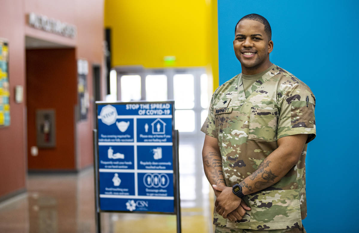 Nevada National Guard Spc. Demetrie Barnett poses for a portrait at the vaccination clinic at t ...