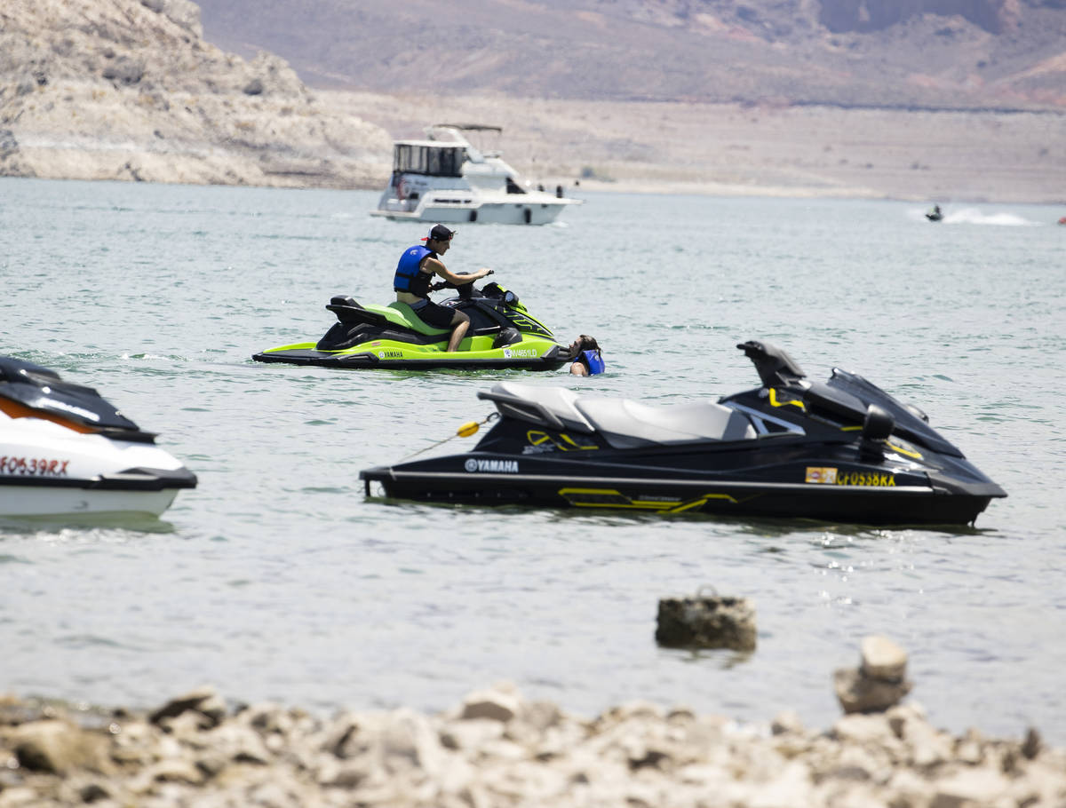 People relax at Boulder Beach in the Lake Mead National Recreation Area, on Friday, July 2, 202 ...