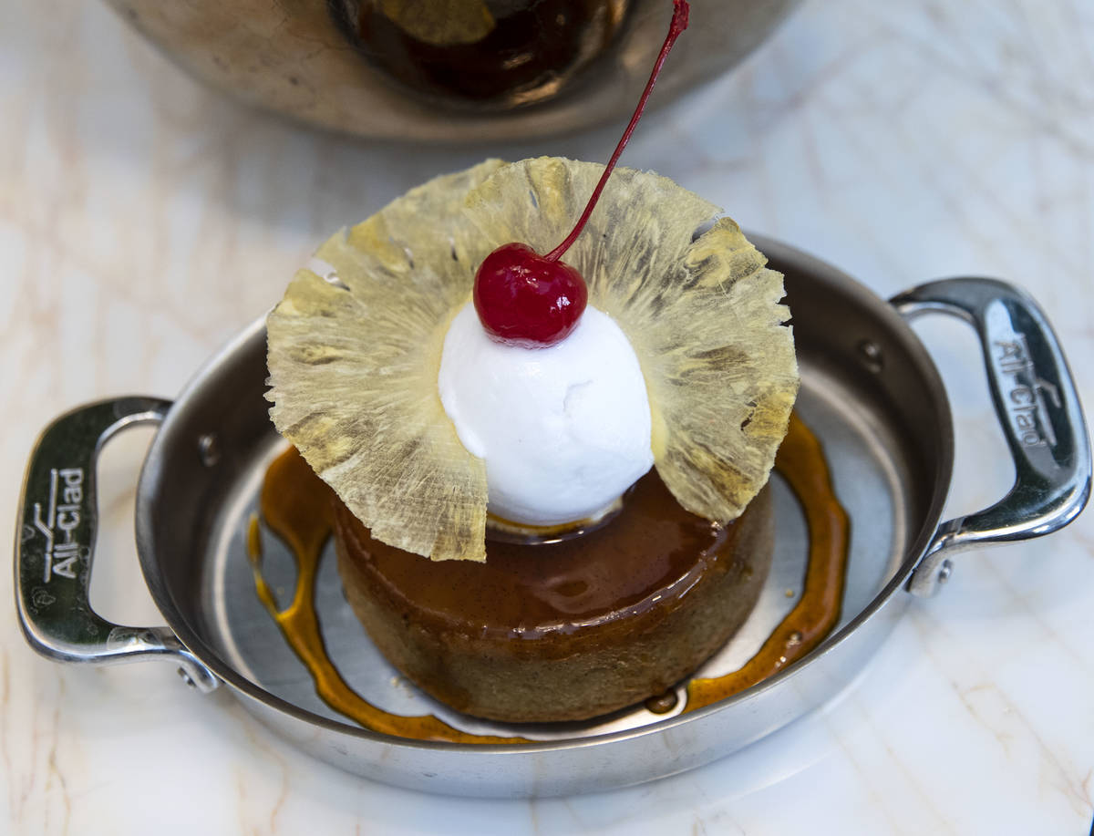 Pineapple upside down cake with a coconut sorbet is displayed at Delilah Supper Club at Wynn, o ...