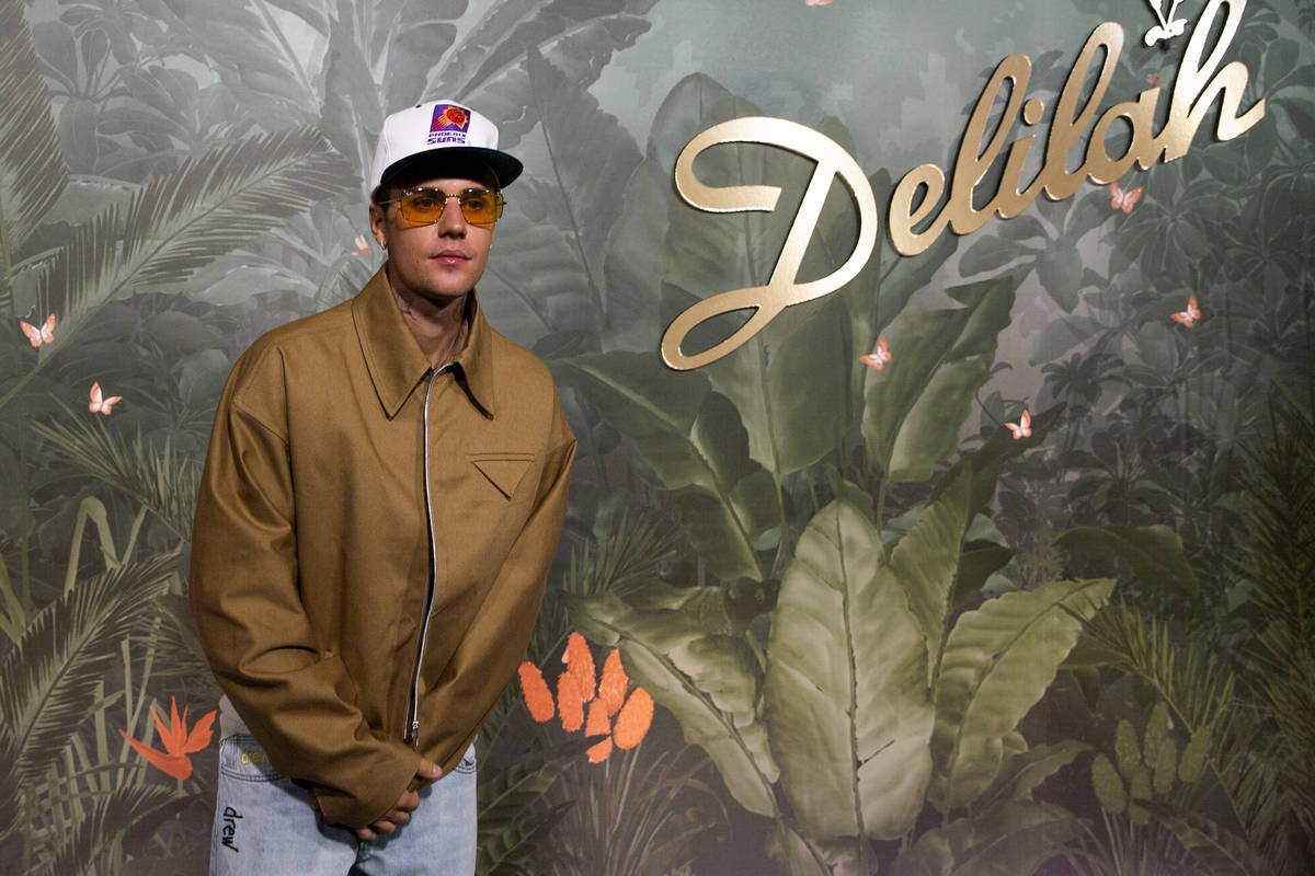 Justin Bieber poses for photographers upon arrival at the grand opening party of Delilah at Wyn ...
