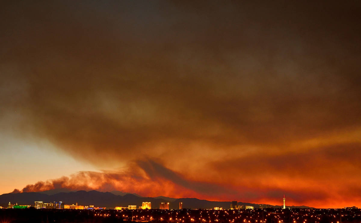 Smoke from the Carpenter 1 Fire rises over the Strip in Las Vegas on Tuesday, July 9, 2013. (Bi ...