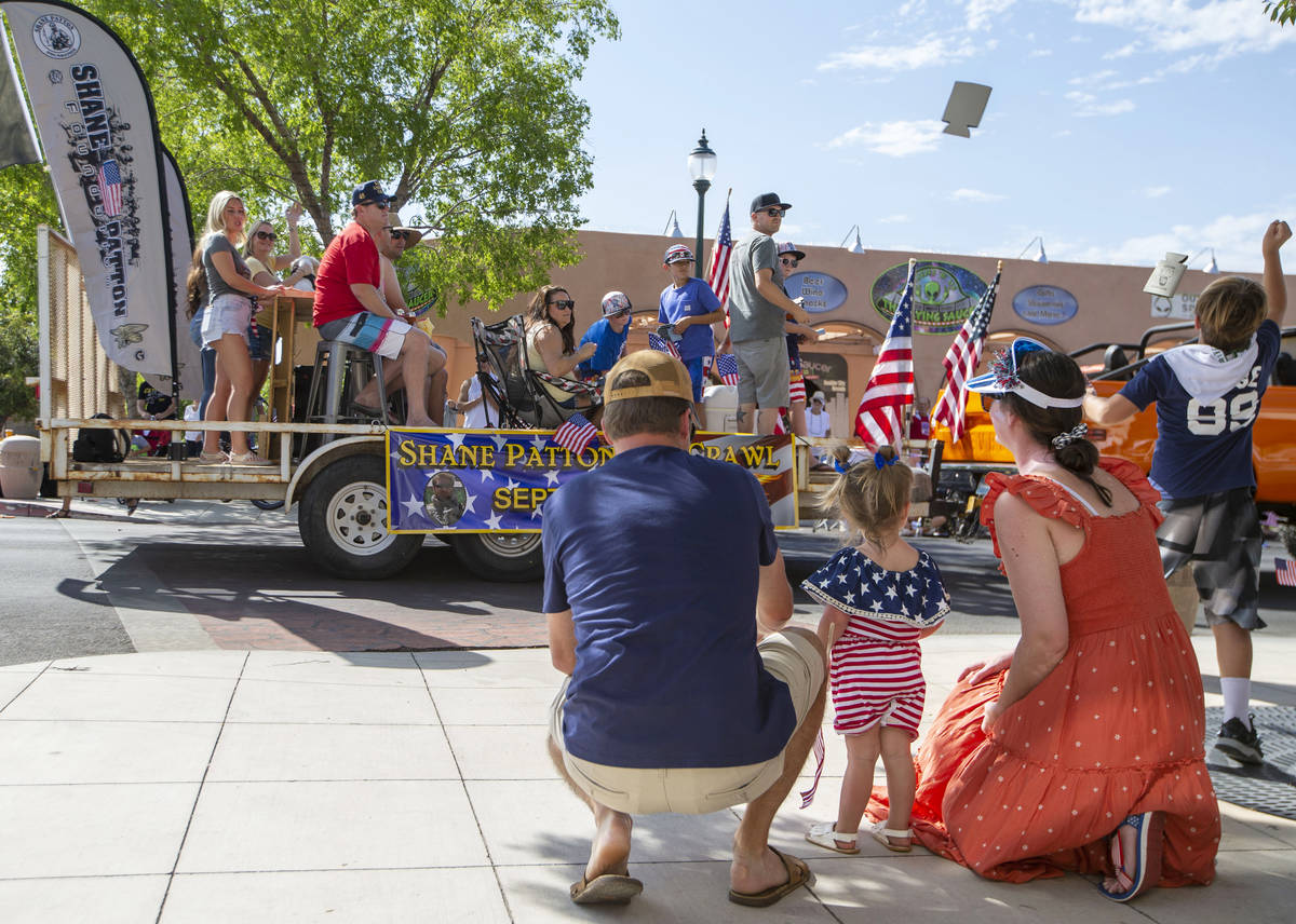 Drink coolers are thrown to parade onlookers during the two-day Damboree event on Saturday, Jul ...