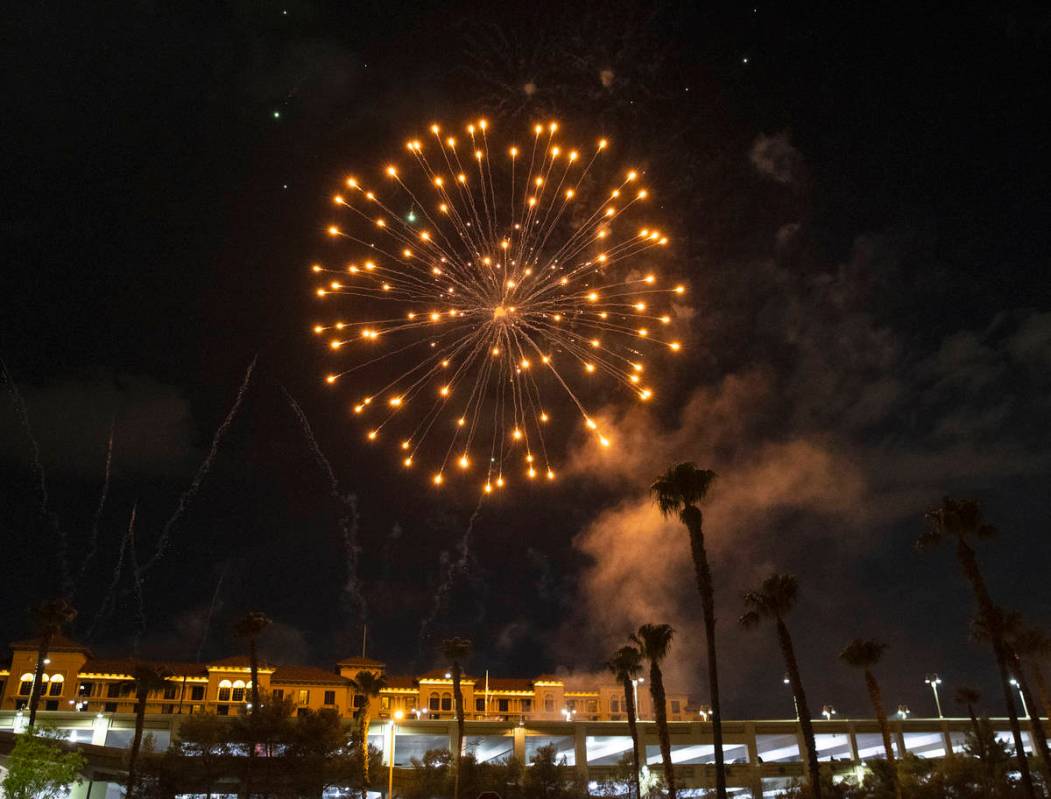 Fireworks go off above the Green Valley Ranch, on Sunday, July 4, 2021, in Henderson. (Bizuayeh ...