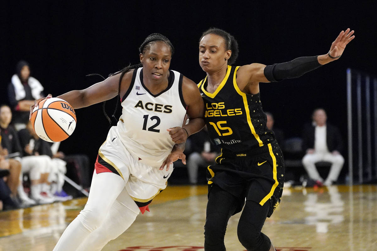 Las Vegas Aces guard Chelsea Gray, left, drives toward the basket as Los Angeles Sparks guard B ...