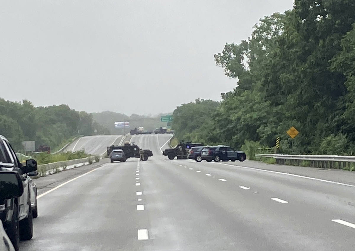 This photo provided by Massachusetts State Police shows police blocking off a section of Inters ...