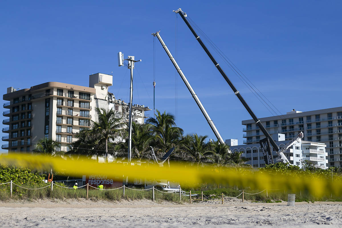 Rescue workers continue to look through rubble for survivors at the partially collapsed Champla ...